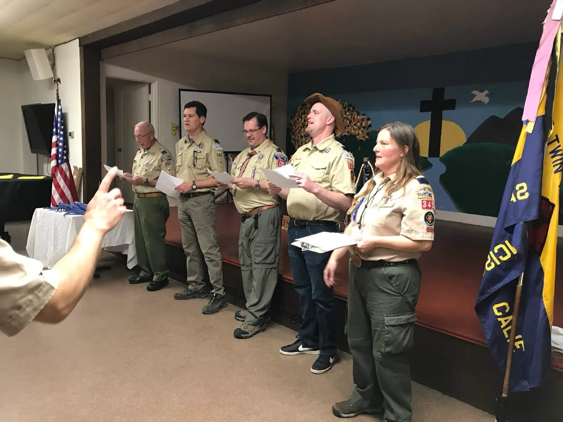 Scouts around a campfire at night