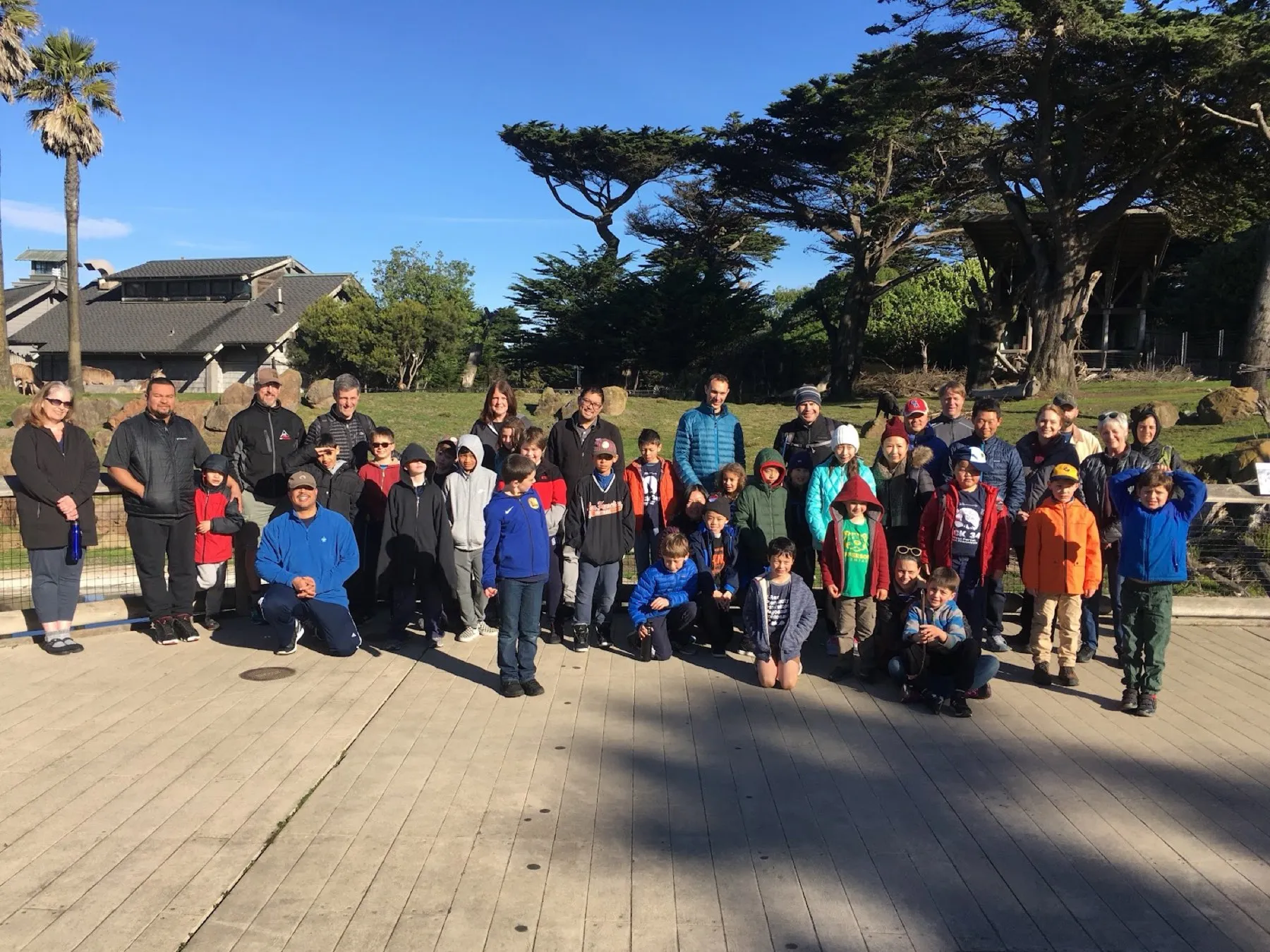 The whole pack gathered for a group photo after a hike